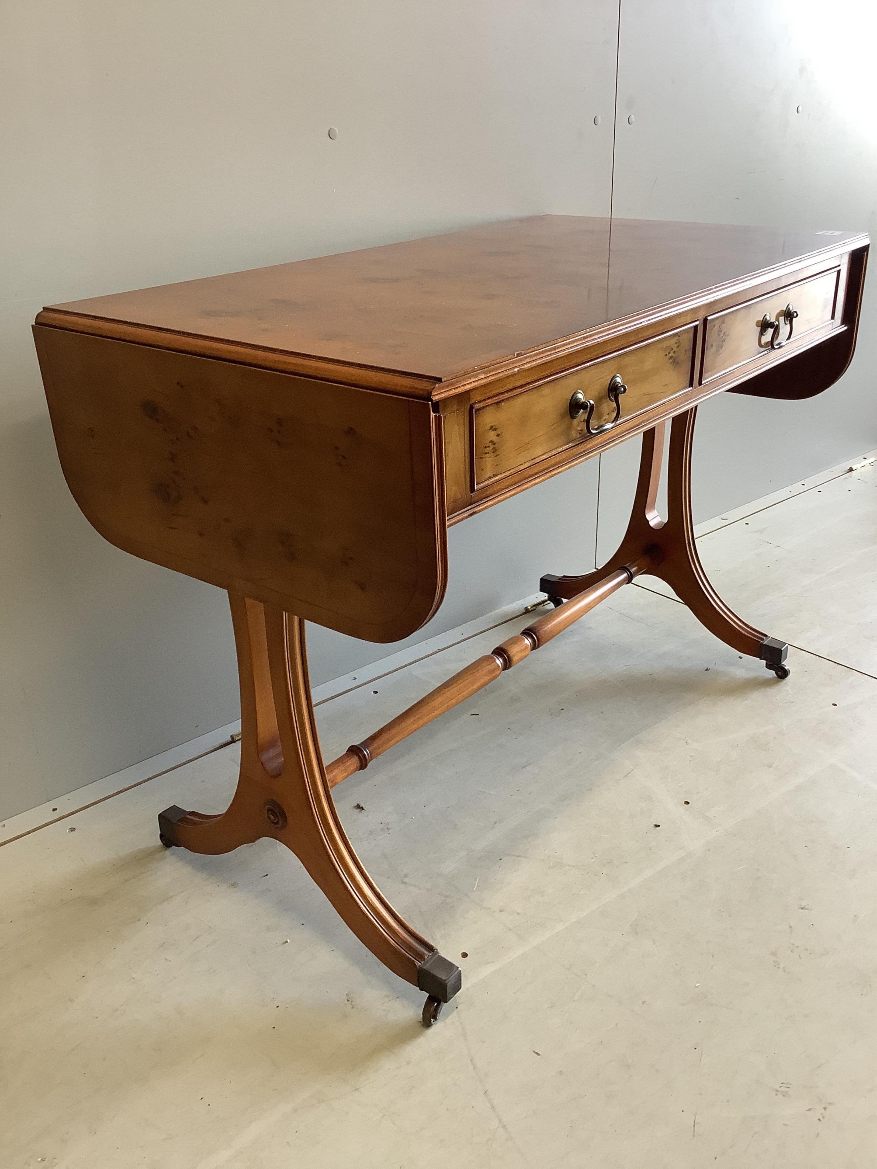 A reproduction Regency style yew sofa table, width 104cm, depth 56cm, height 74cm. Condition - good